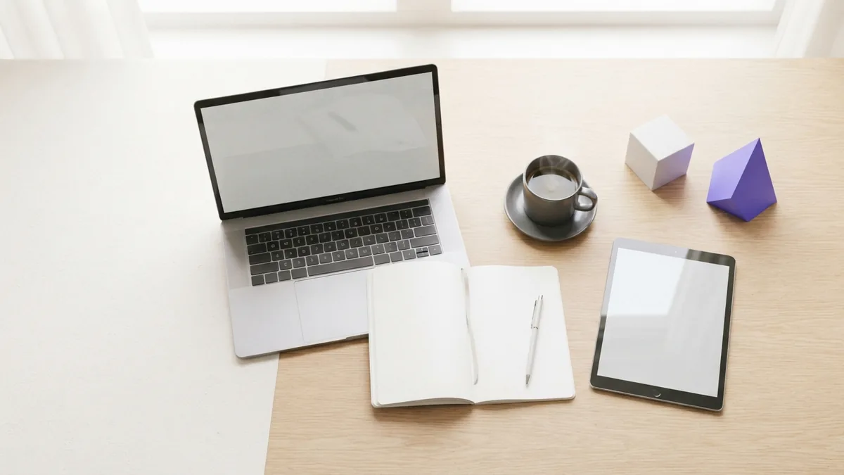Digital marketing tools workspace Clean desk with laptop and tablet for using digital marketing tools